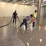 Spreading out the concrete overlay